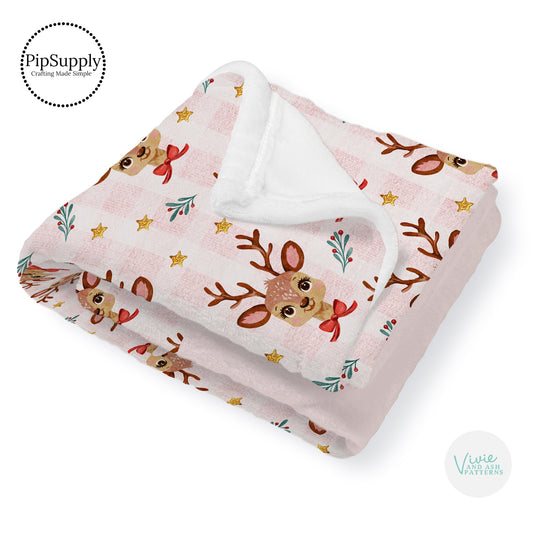 This winter designer pattern is printed onto the front side of our soft touch minky blankets. The backside will not be printed and left the natural cream/white color of the blanket. This print pattern features Christmas reindeer on pink.