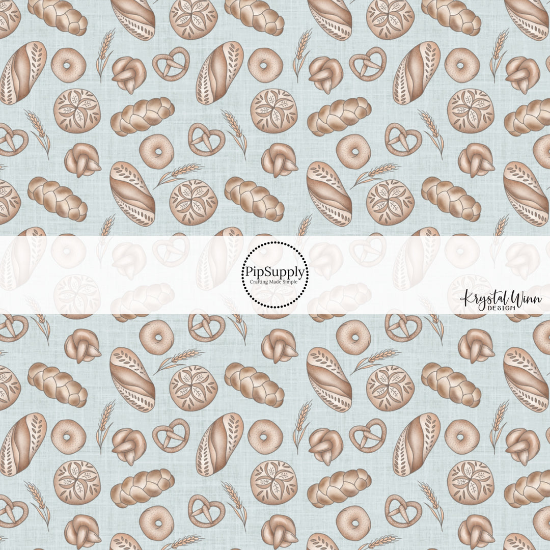 This Easter fabric by the yard features baked bread and bagels on blue. This fun pattern fabric can be used for all your sewing and crafting needs!