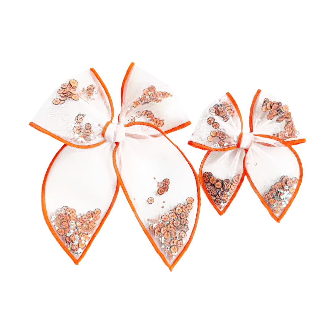 These sports serged edge pre-cut tied bows are ready to package and resell to your customers no sewing or measuring necessary! These hair bows come with a clip already attached. The shaker bows come pre-filled with basketball clay slices.