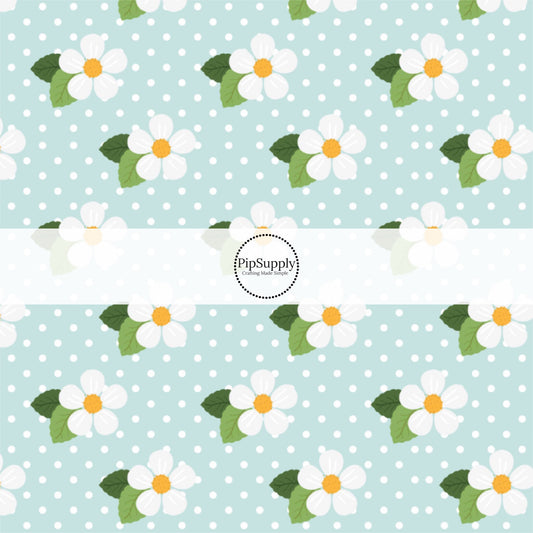 This summer fabric by the yard features white flowers on light blue. This fun themed fabric can be used for all your sewing and crafting needs!