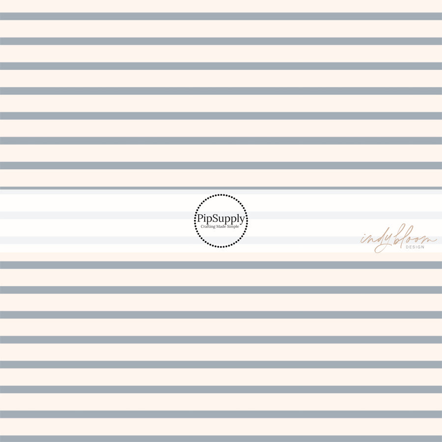 This summer fabric by the yard features cream and light blue stripes. This fun summer themed fabric can be used for all your sewing and crafting needs!