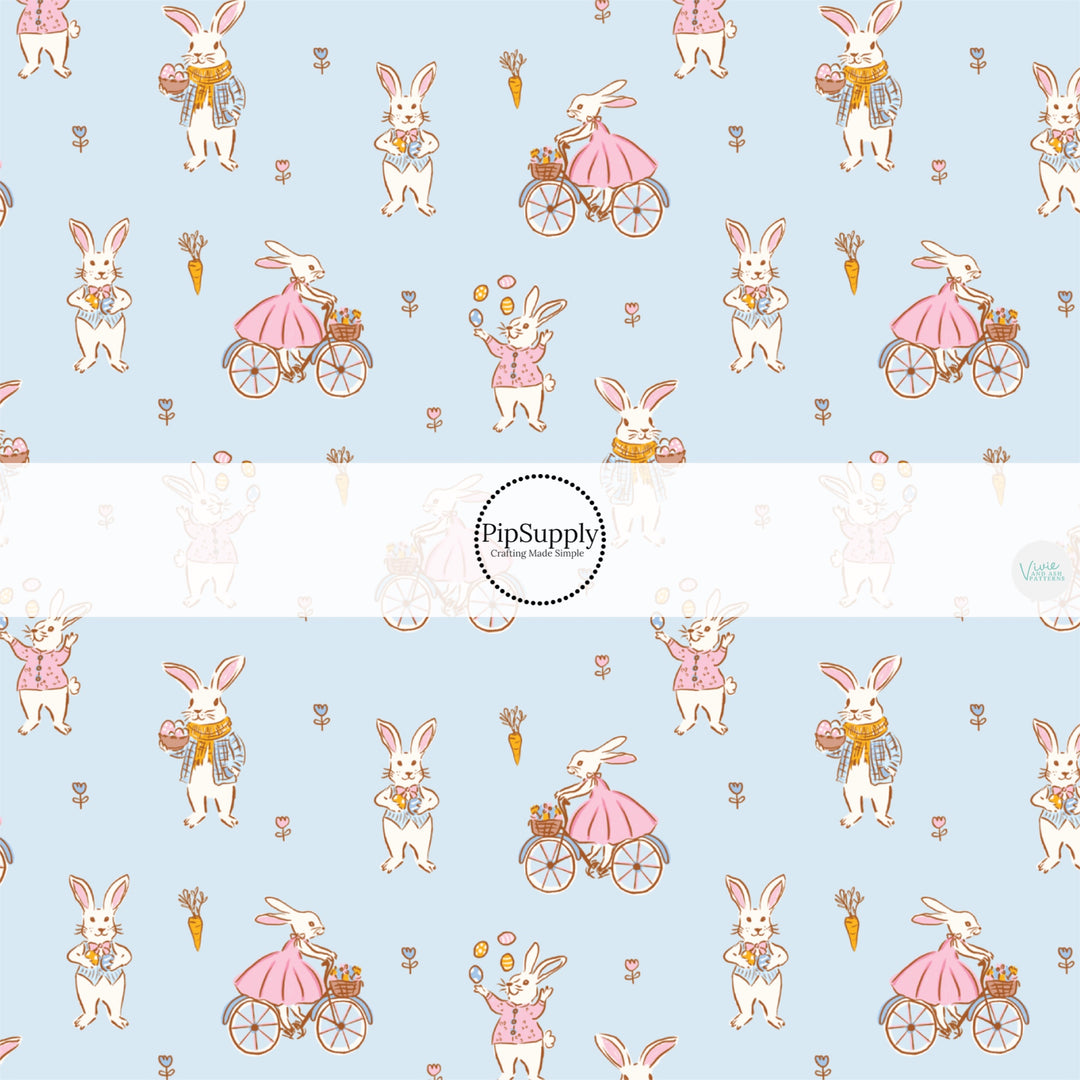 This Easter themed fabric by the yard features talented bunnies on bicycles on blue. This fun pattern fabric can be used for all your sewing and crafting needs!