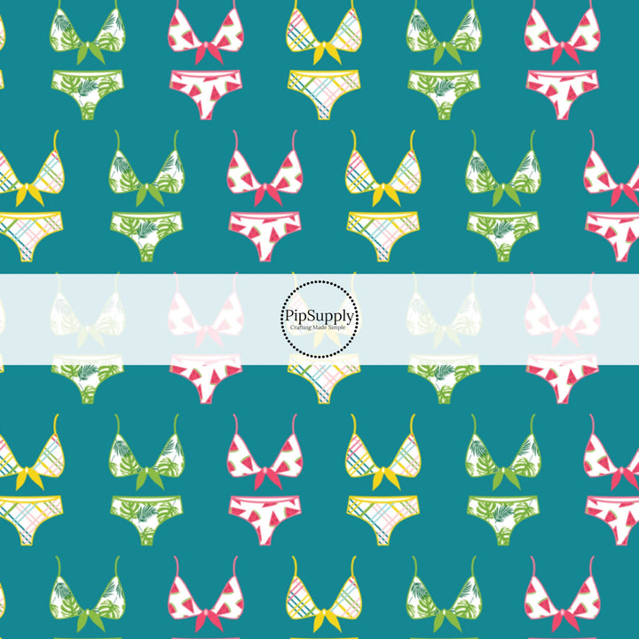 This summer fabric by the yard features swimsuits on teal. This fun themed fabric can be used for all your sewing and crafting needs!