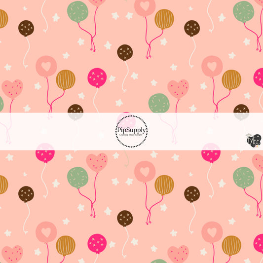 This celebration fabric by the yard features colorful balloons on pink. This fun birthday themed fabric can be used for all your sewing and crafting needs!