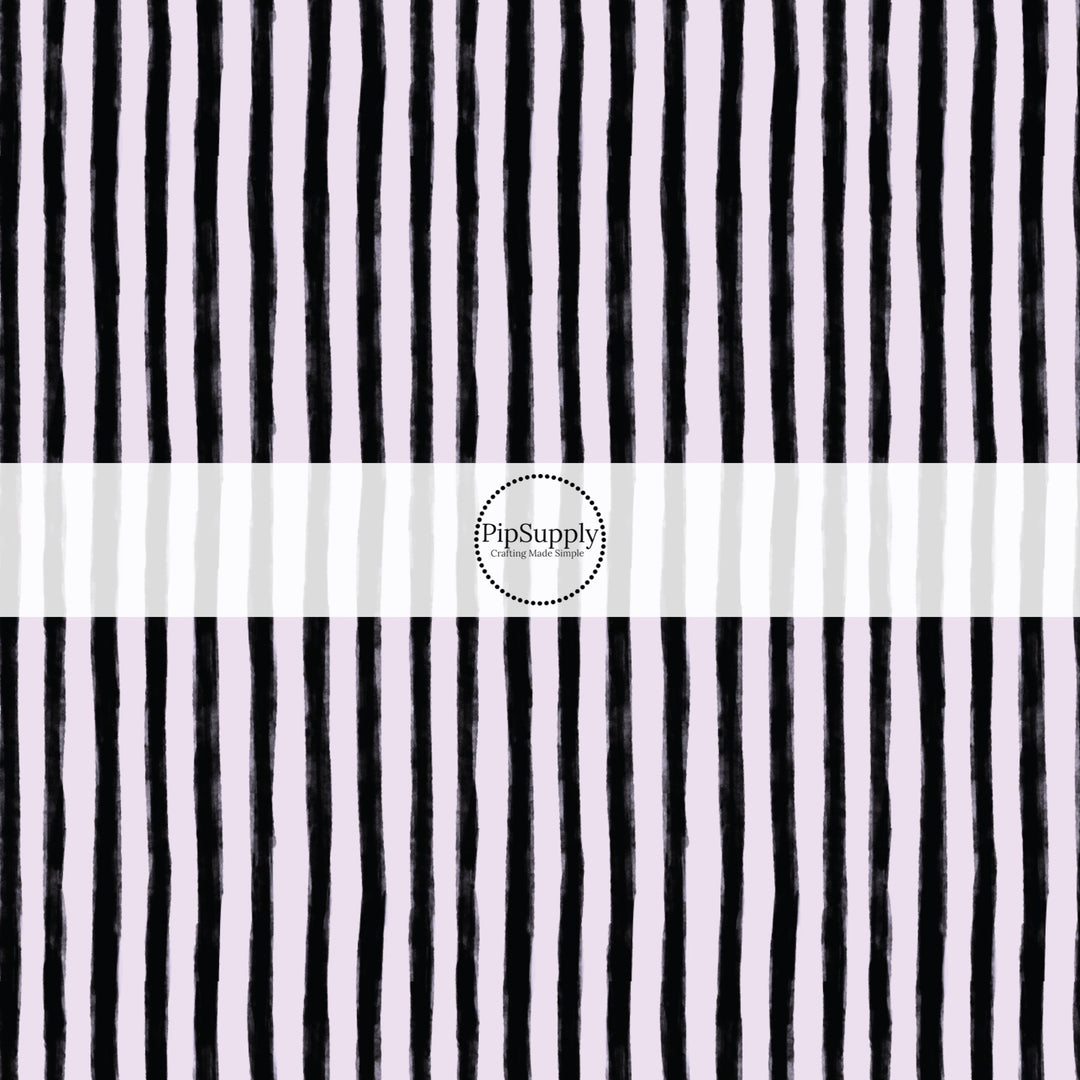 These stripe themed pattern fabric by the yard features the following design elements: black and lilac Halloween stripes. This fun themed fabric can be used for all your sewing and crafting needs!