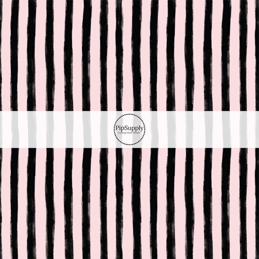 These stripe themed pattern fabric by the yard features the following design elements: black and pink Halloween stripes. This fun themed fabric can be used for all your sewing and crafting needs!