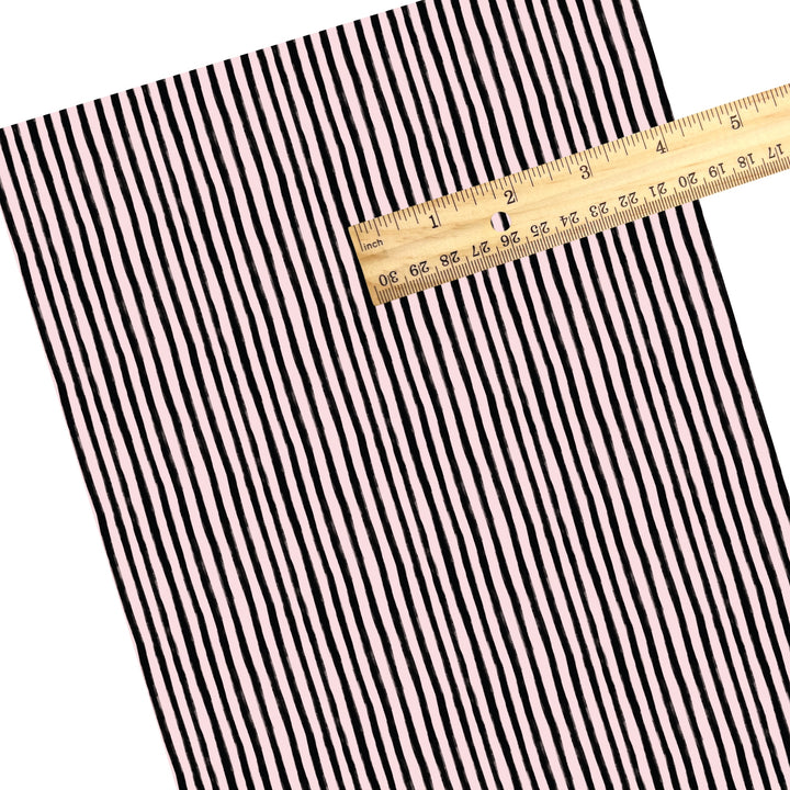 These stripe themed pattern faux leather sheets contain the following design elements: black and pink Halloween stripes. Our CPSIA compliant faux leather sheets or rolls can be used for all types of crafting projects.