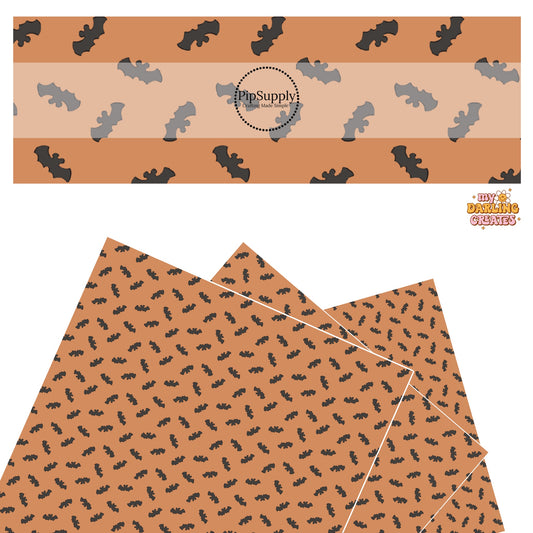 Black bats with mouse ears on orange faux leather sheets