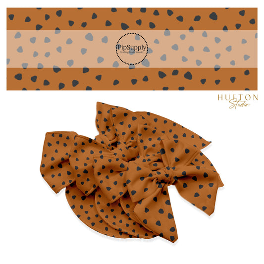 These speckled themed no sew bow strips can be easily tied and attached to a clip for a finished hair bow. These fun dot bow strips are great for personal use or to sell. The bow stripes features small black speckled dots on brown.