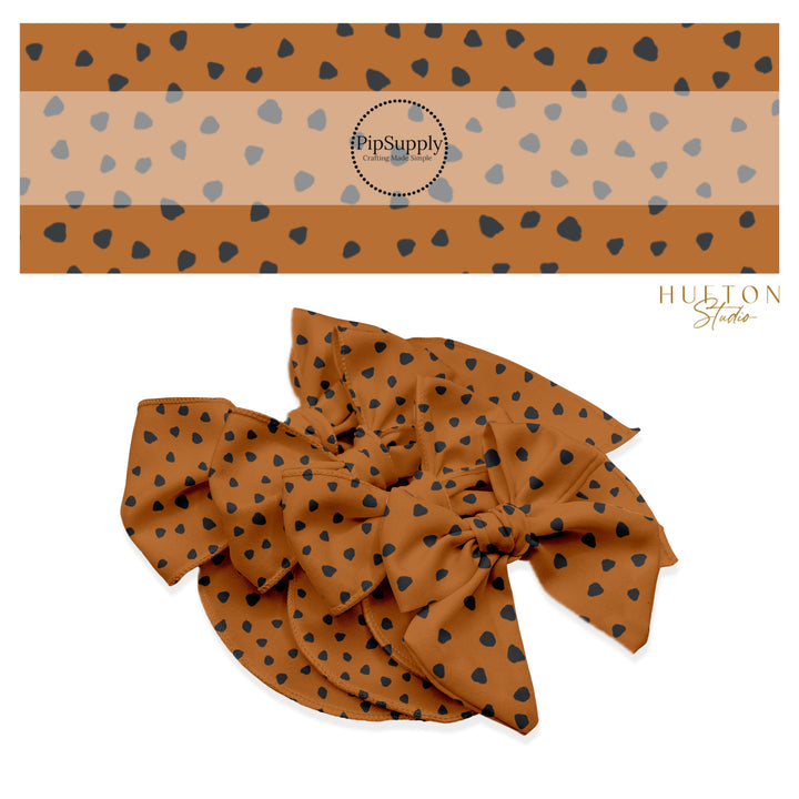 These speckled themed no sew bow strips can be easily tied and attached to a clip for a finished hair bow. These fun dot bow strips are great for personal use or to sell. The bow stripes features small black speckled dots on brown.