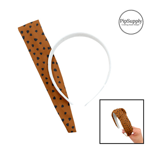 These speckled themed headband kits are easy to assemble and come with everything you need to make your own knotted headband. These kits include a custom printed and sewn fabric strip and a coordinating velvet or ribbed headband. The headband kits features small black speckled dots on brown.