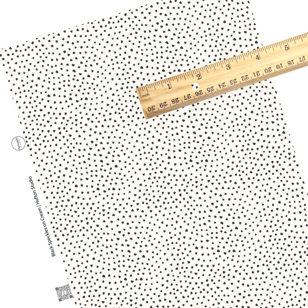 These speckled themed faux leather sheets contain the following design elements: small black speckled dots on ivory. Our CPSIA compliant faux leather sheets or rolls can be used for all types of crafting projects.