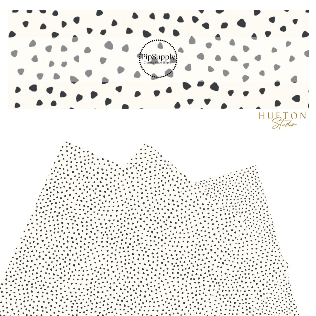 These speckled themed faux leather sheets contain the following design elements: small black speckled dots on ivory. Our CPSIA compliant faux leather sheets or rolls can be used for all types of crafting projects.