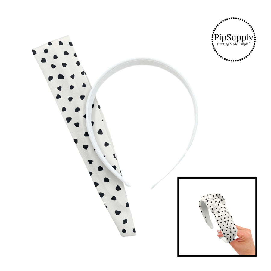 These speckled themed headband kits are easy to assemble and come with everything you need to make your own knotted headband. These kits include a custom printed and sewn fabric strip and a coordinating velvet or ribbed headband. The headband kits features small black speckled dots on ivory.