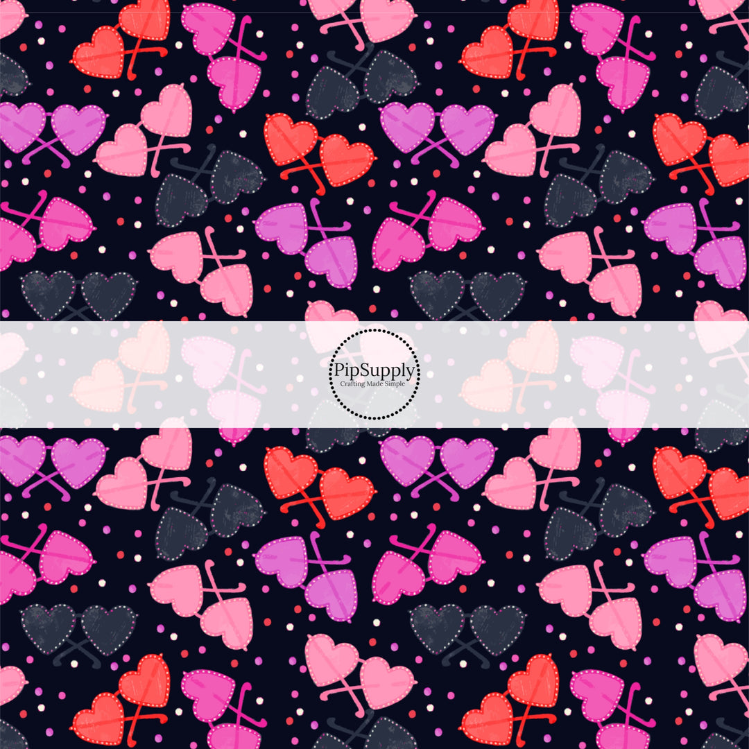 This holiday fabric by the yard features colorful heart glasses. This festive pattern fabric can be used for all your sewing and crafting needs!