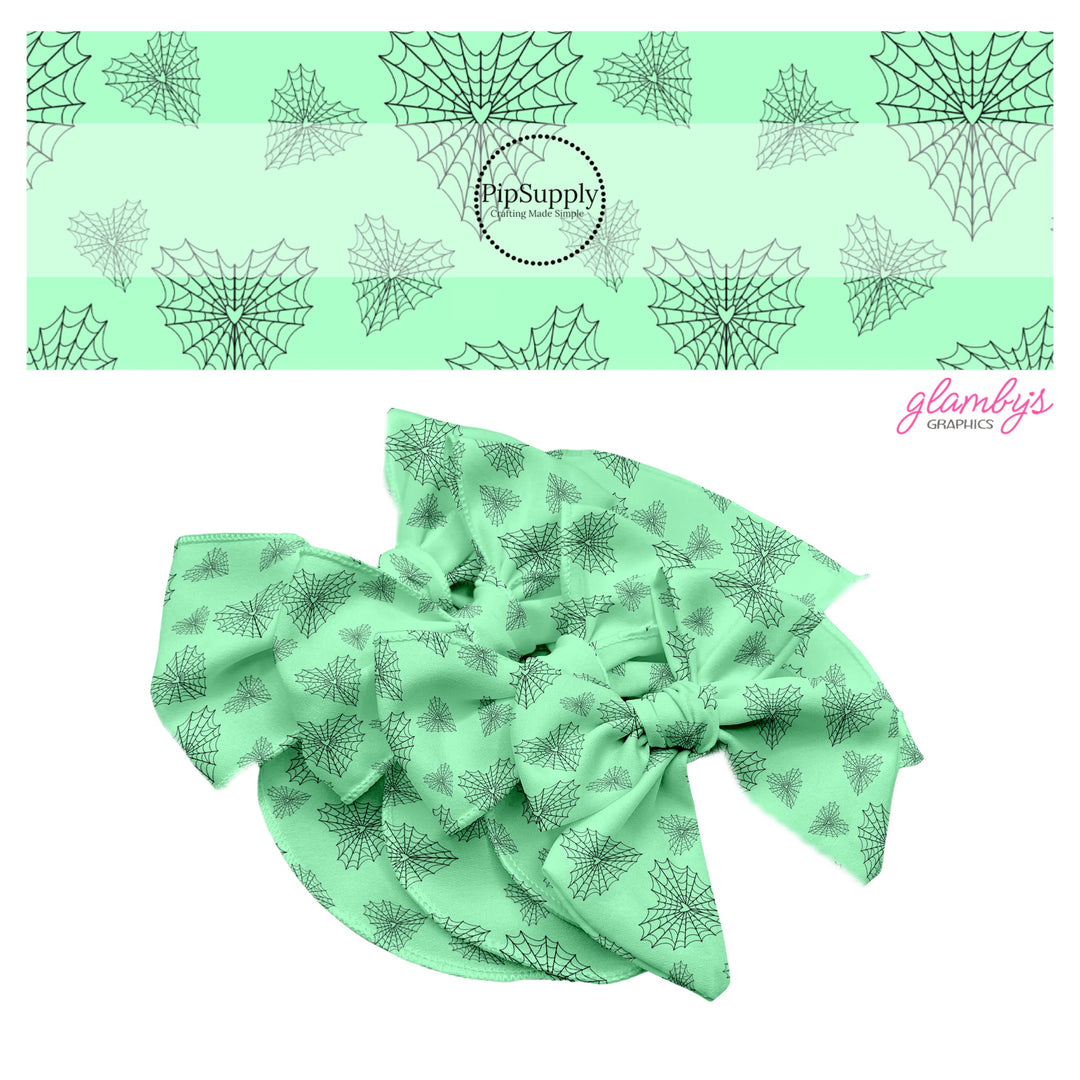 Black heart shaped webs on mint hair bow strips