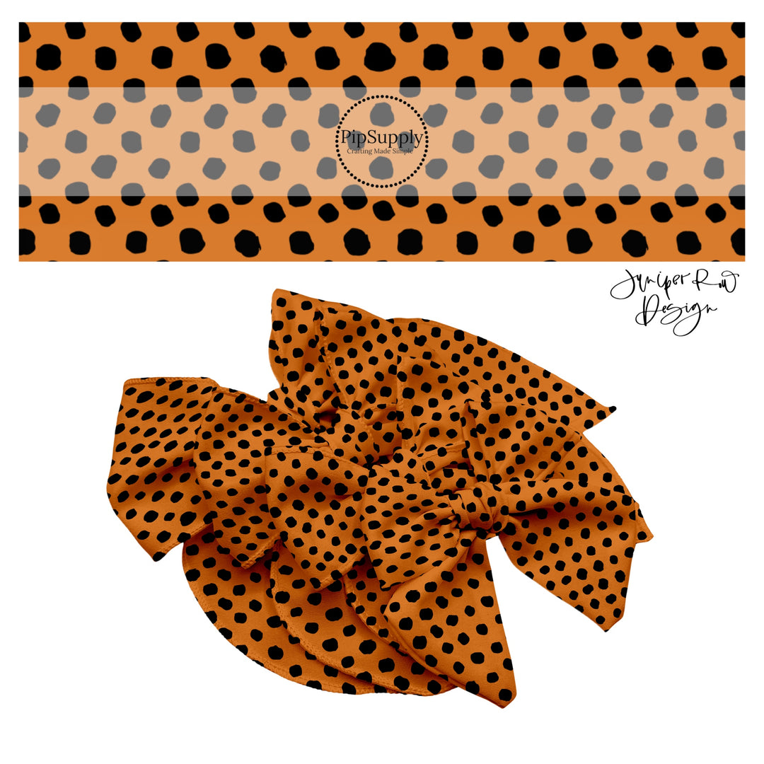 Black dots on orange hair bow strip