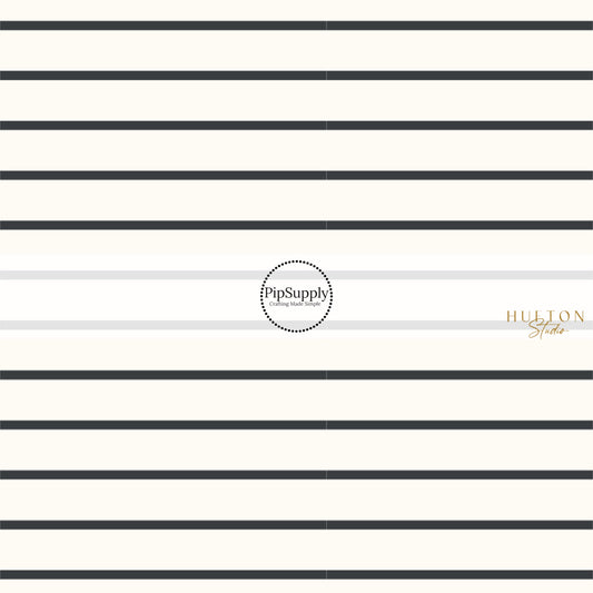 These pinstripe themed light cream fabric by the yard features thin black stripes on ivory. This fun stripe themed fabric can be used for all your sewing and crafting needs! 