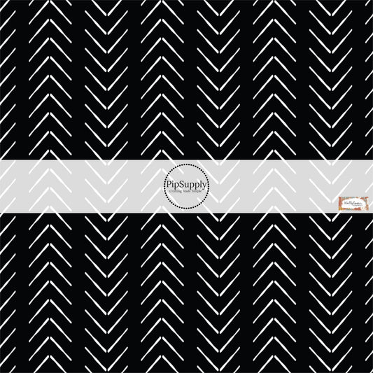 These Halloween themed pattern fabric by the yard features the following design elements: white chevron pattern on black. This fun spooky themed fabric can be used for all your sewing and crafting needs!