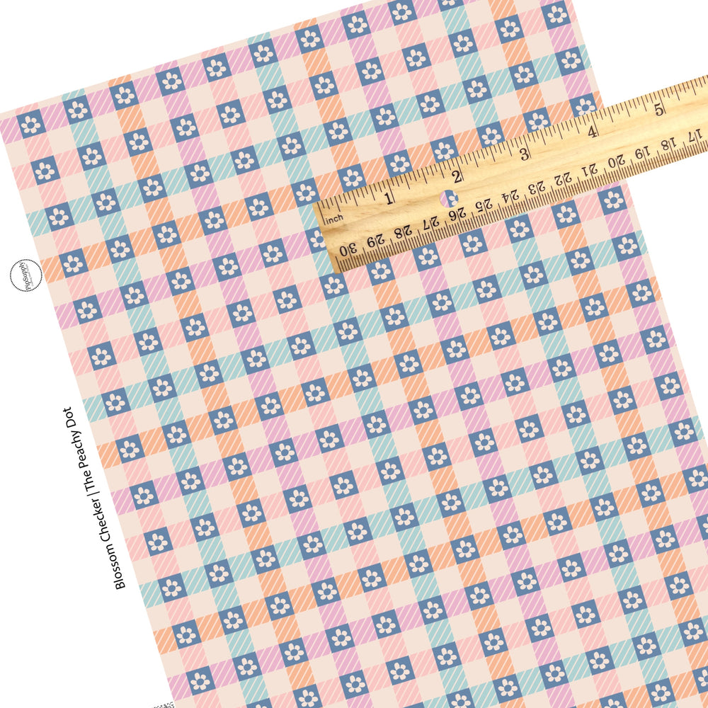 These spring checker pattern themed faux leather sheets contain the following design elements: small flowers on pink, orange, and blue checkers. Our CPSIA compliant faux leather sheets or rolls can be used for all types of crafting projects.