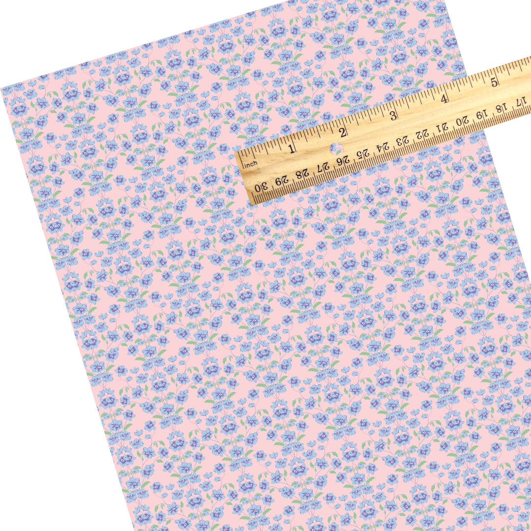 These spring floral themed faux leather sheets contain the following design elements: blue flowers on pink. Our CPSIA compliant faux leather sheets or rolls can be used for all types of crafting projects.