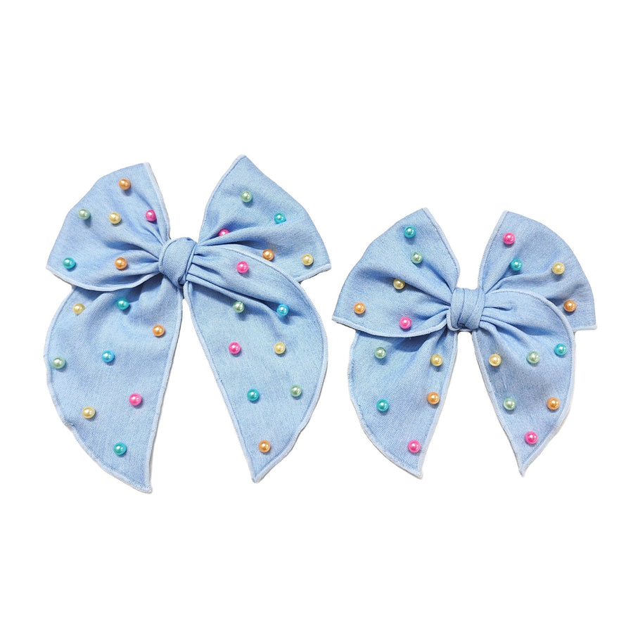 These spring blue denim pearl tied bows are ready to package and resell to your customers no sewing or measuring necessary! These hair bows come with a alligator clip already attached. Along with pastel multi colored pearls.