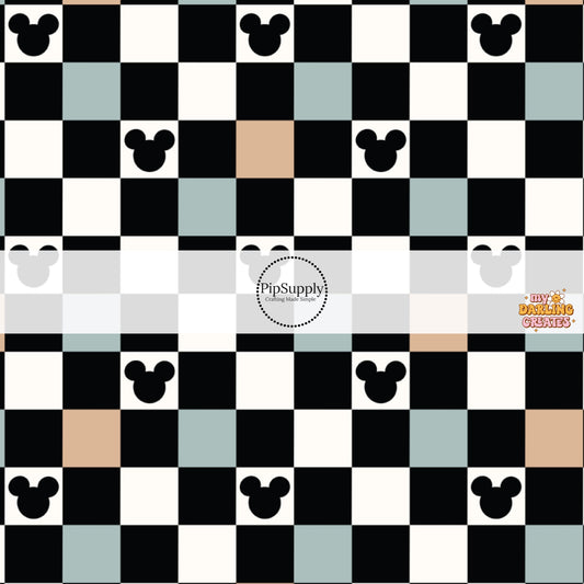 This magical inspired fabric by the yard features the following design: blue, black, nude and cream checker pattern with mouse ears. This fun themed fabric can be used for all your sewing and crafting needs!