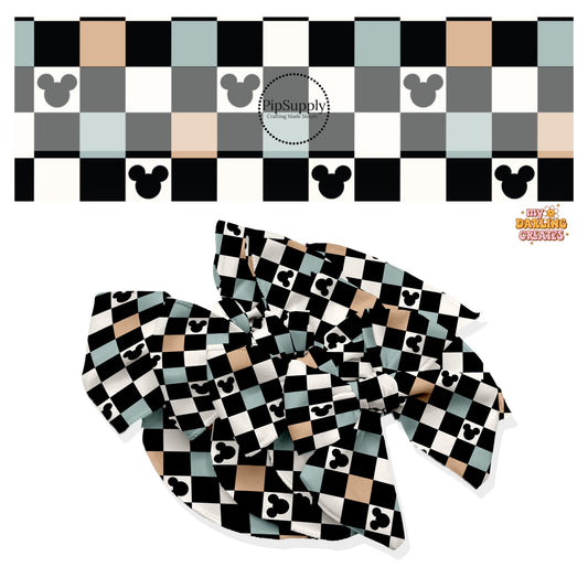 These magical inspired themed no sew bow strips can be easily tied and attached to a clip for a finished hair bow. These fun themed patterned bow strips are great for personal use or to sell. These bow strips feature the following blue, black, nude and cream checker pattern with mouse ears.