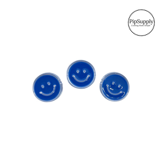 Clear bead with blue smiley face bead embellishment