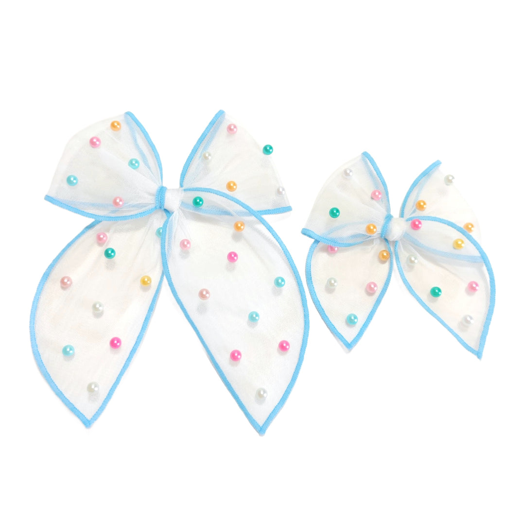 These spring tulle serged edge pre-cut tied bows with pearls are ready to package and resell to your customers no sewing or measuring necessary! These hair bows come with a clip already attached.