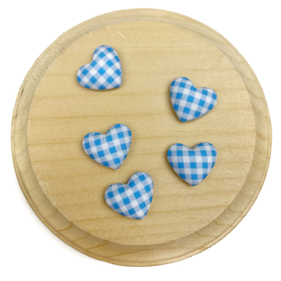 Heart-shaped flat back embellishment featuring a blue and white gingham plaid pattern with a softly padded, fabric-covered appearance. Finished with smooth edges and a charming, classic design, perfect for bows, hair accessories, scrapbooking, and craft projects.

Silver, flat backing
Sets of 10
Approx 1.9cm l x 1.58cm 