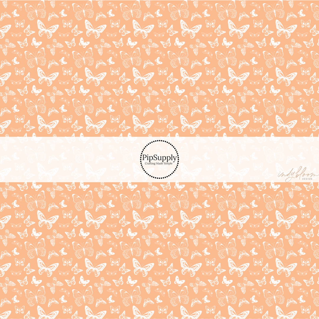 These spring fabric by the yard features boho butterflies on peach. This fun pattern fabric can be used for all your sewing and crafting needs!