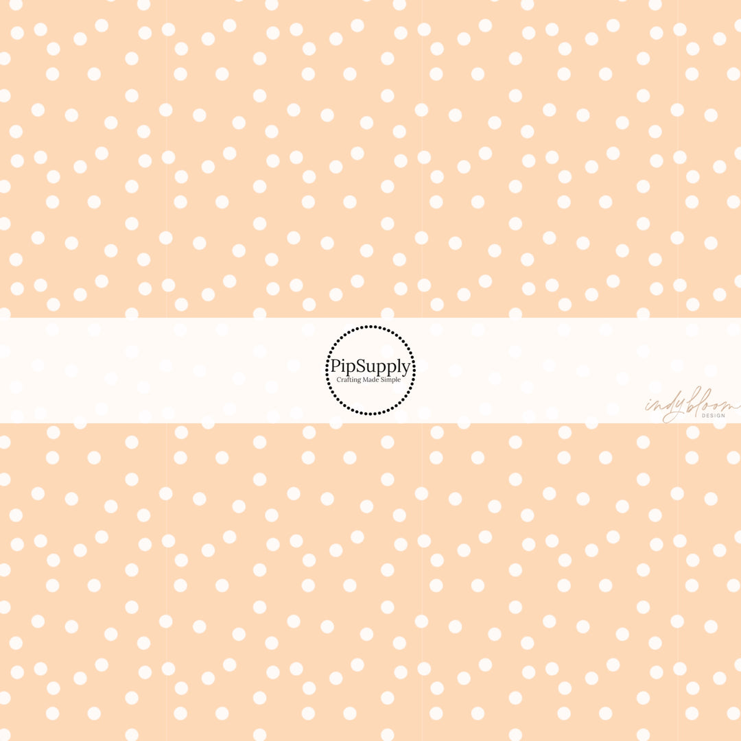 These spring fabric by the yard features boho dots on peach. This fun pattern fabric can be used for all your sewing and crafting needs! 