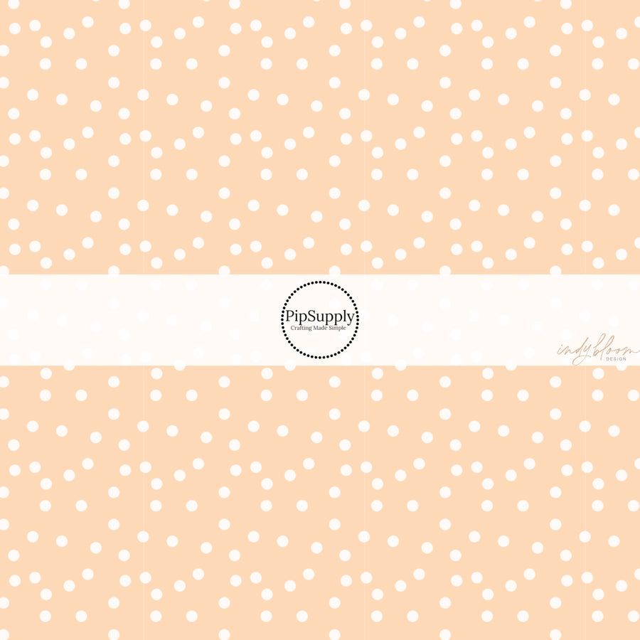 These spring fabric by the yard features boho dots on peach. This fun pattern fabric can be used for all your sewing and crafting needs! 