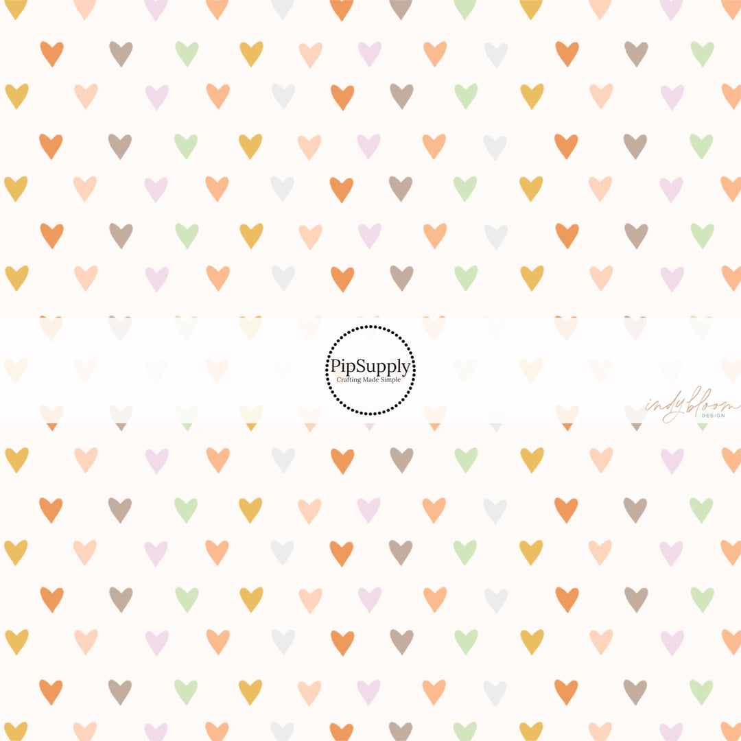 These spring fabric by the yard features boho pastel heart pattern. This fun pattern fabric can be used for all your sewing and crafting needs!