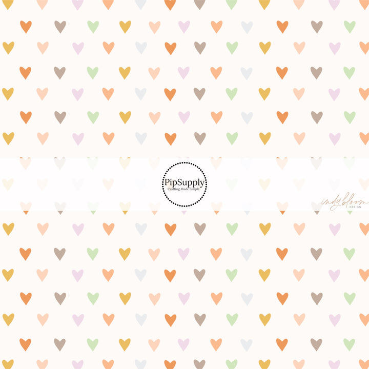 These spring fabric by the yard features boho pastel heart pattern. This fun pattern fabric can be used for all your sewing and crafting needs!