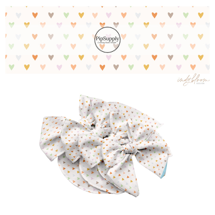 These spring themed no sew bow strips can be easily tied and attached to a clip for a finished hair bow. These bow strips are great for personal use or to sell. These bow strips feature the following design elements: boho pastel heart pattern.