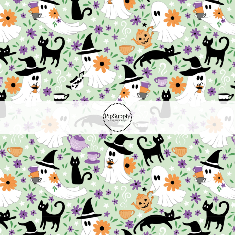 These Halloween themed pattern fabric by the yard features the following design elements: ghost, cats, and tea cups on light green. This fun spooky themed fabric can be used for all your sewing and crafting needs!