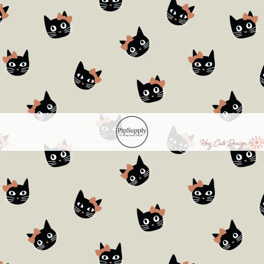 These Halloween themed pattern fabric by the yard features the following design elements: colorful cats with bows on cream. This fun spooky themed fabric can be used for all your sewing and crafting needs!