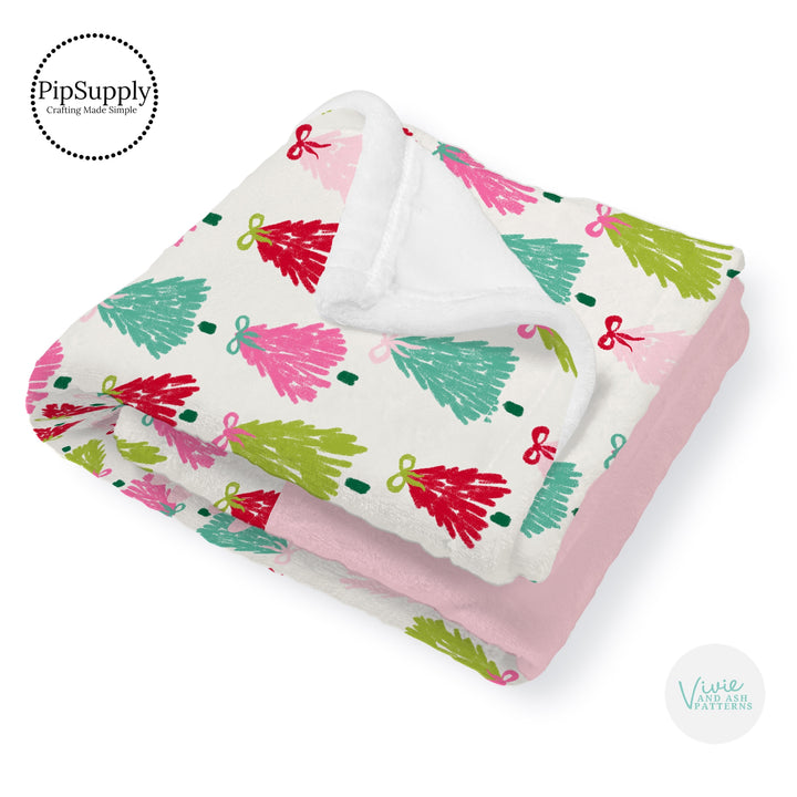 This winter designer pattern is printed onto the front side of our soft touch minky blankets. The backside will not be printed and left the natural cream/white color of the blanket. This print pattern features colorful Christmas trees with bows.