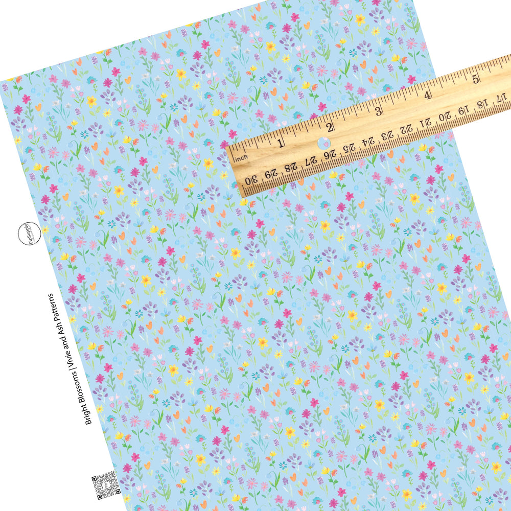 These floral pattern themed faux leather sheets contain the following design elements: colorful flowers on light blue. Our CPSIA compliant faux leather sheets or rolls can be used for all types of crafting projects.