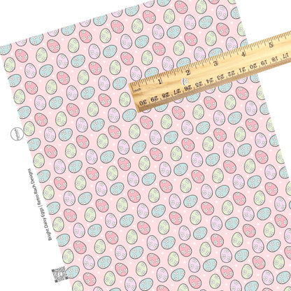 These spring pattern themed faux leather sheets contain the following design elements: pastel colored Easter eggs with white daisies on light pink. Our CPSIA compliant faux leather sheets or rolls can be used for all types of crafting projects.