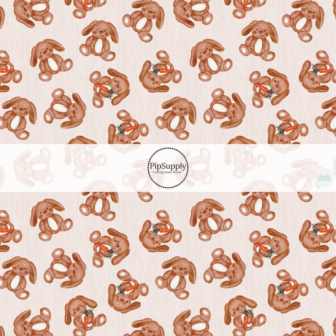 This Easter themed fabric by the yard features brown bunnies with carrots. This fun pattern fabric can be used for all your sewing and crafting needs!