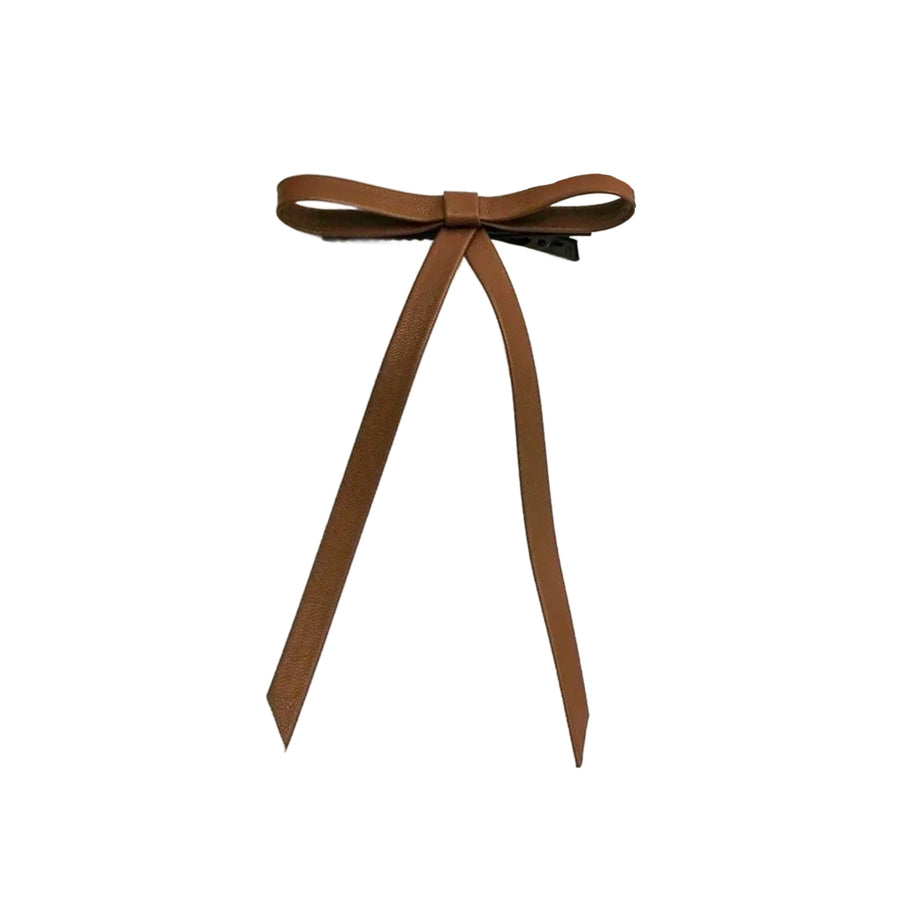 These brown leather long tail tied bows are ready to package and resell to your customers no sewing or measuring necessary! These hair bows come with a alligator clip already attached.