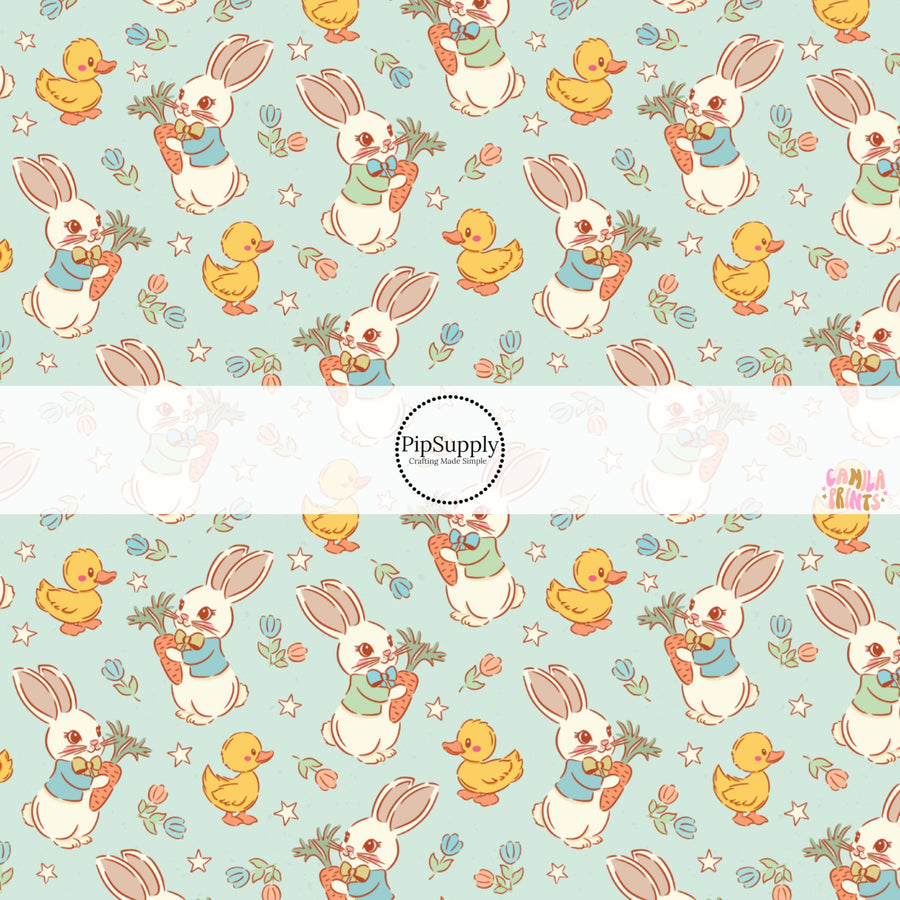 This Easter themed fabric by the yard features Easter bunnies and ducks on blue. This fun pattern fabric can be used for all your sewing and crafting needs!