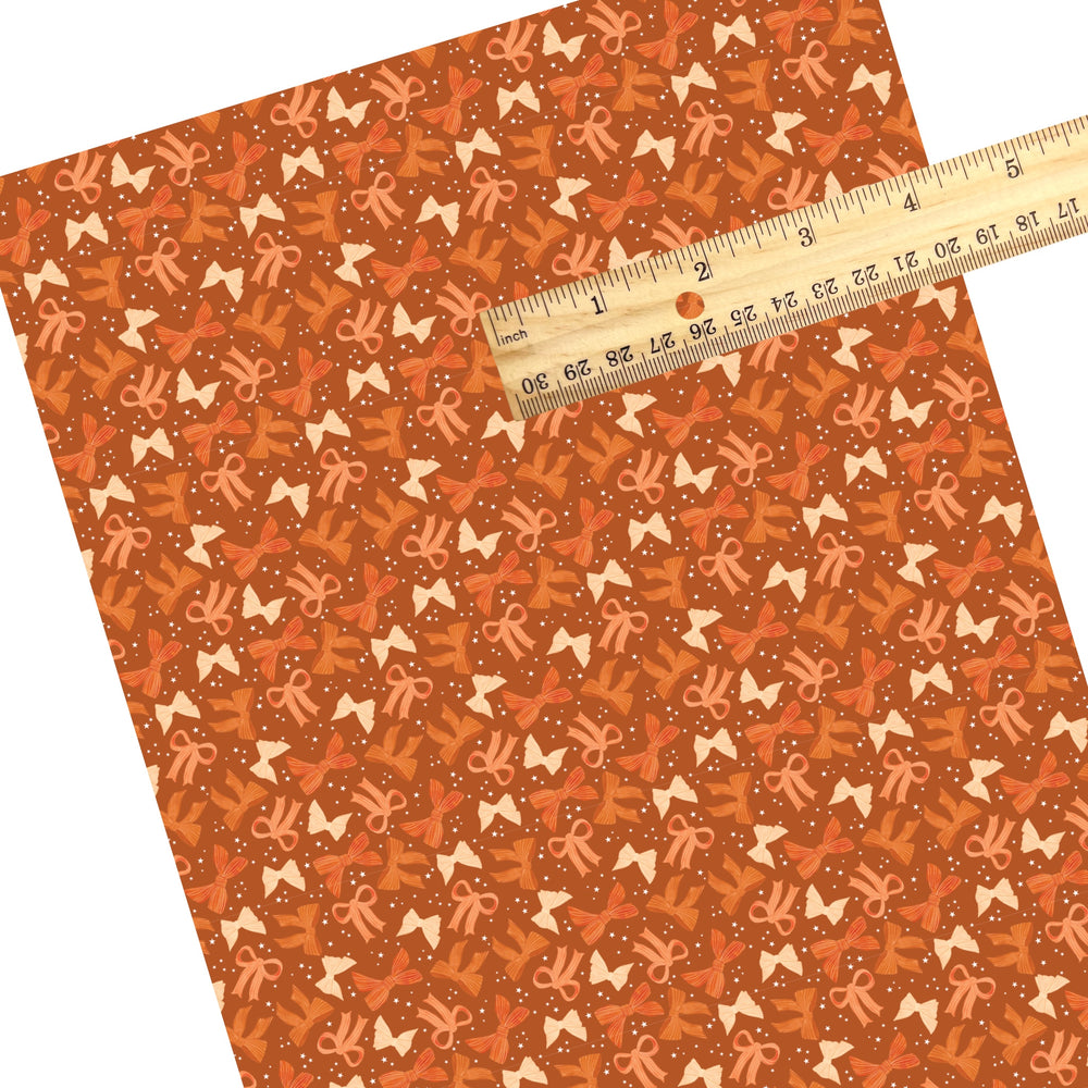 These autumn themed pattern faux leather sheets contain the following design elements: colorful fall bows on orange. Our CPSIA compliant faux leather sheets or rolls can be used for all types of crafting projects.