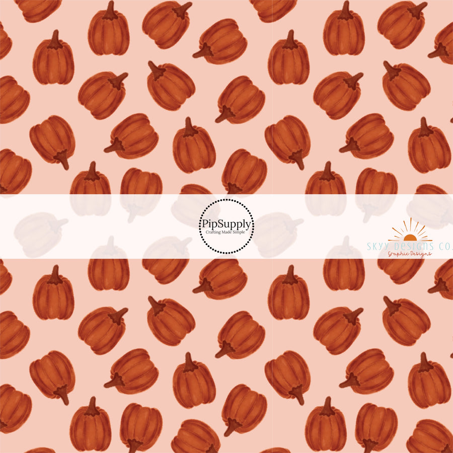 These autumn themed pattern fabric by the yard features the following design elements: burnt orange pumpkins. This fun themed fabric can be used for all your sewing and crafting needs!