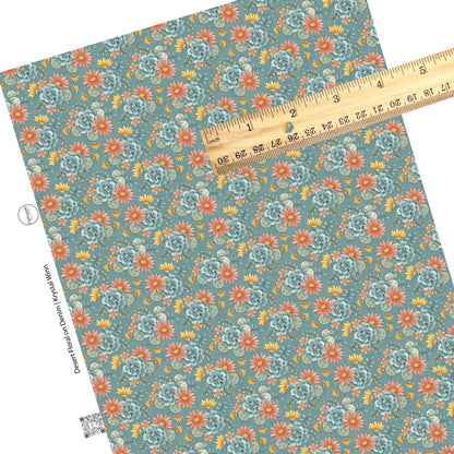 These desert flowers on light blue faux leather sheets contain the following design elements: yellow, pink, orange, blue, teal, and green flowers and cacti.