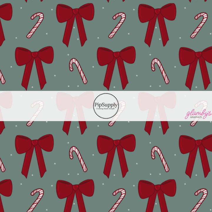 These winter bow themed pattern fabric by the yard features the following design elements: candy canes and red bows. This fun themed fabric can be used for all your sewing and crafting needs!