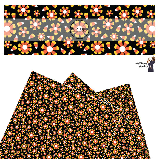 Scattered candy corn with candy corn flowers on black faux leather sheets